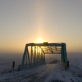 Coffin Bridge Parhelion,  12x29in Hahnemuhle Fine Art Pearl Print ~ Luminous diamond dust drapes the Iron Coffin. Cold light bends mocking the sun. 'Dazzle mine eyes' Parhelion.