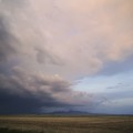 Spring Storm,  19x24in Moab Entrada Rag Print ~ The distant peal of thunder announced the coming rain. The blackened wall of water immeresed the eastern plain In hope and dreams of autumn. And bounty from the grain.